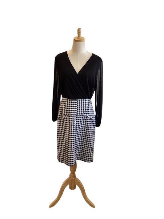 Black v neck dress with blk/wht hounds tooth skirt and sheer blk sleeve