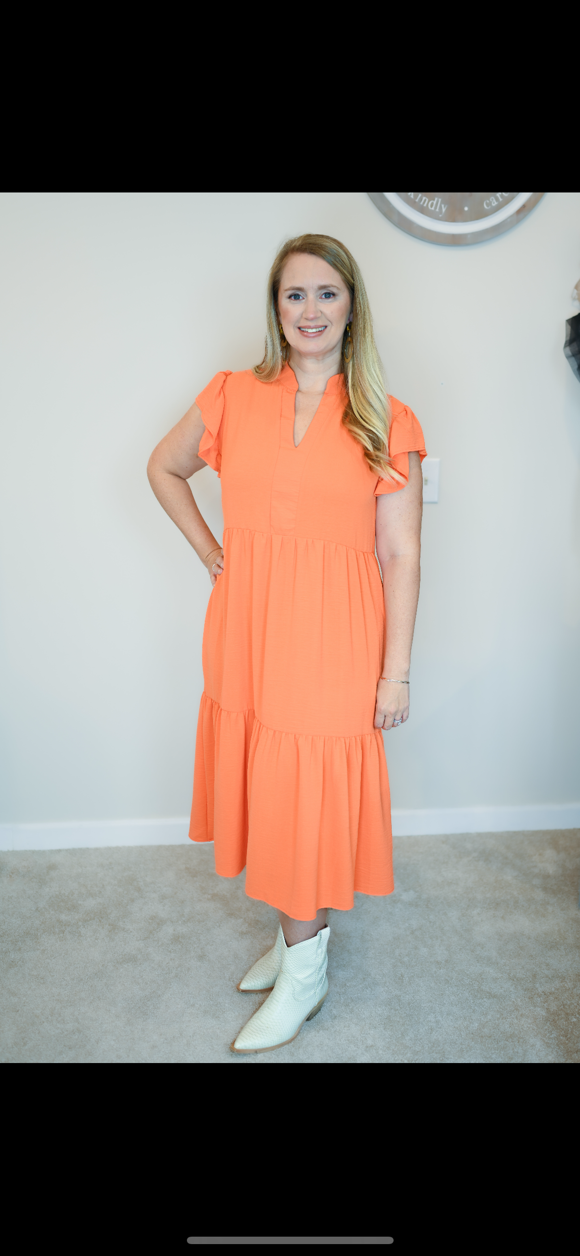 Mid-length tiered orange dress with ruffle sleeve