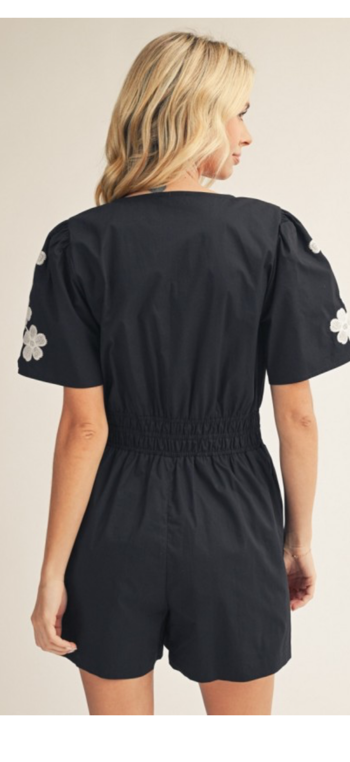 Jodifl  black elastic waist romper with white flower appliqué