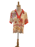 ￼Jodifl cream, floral coral trim top