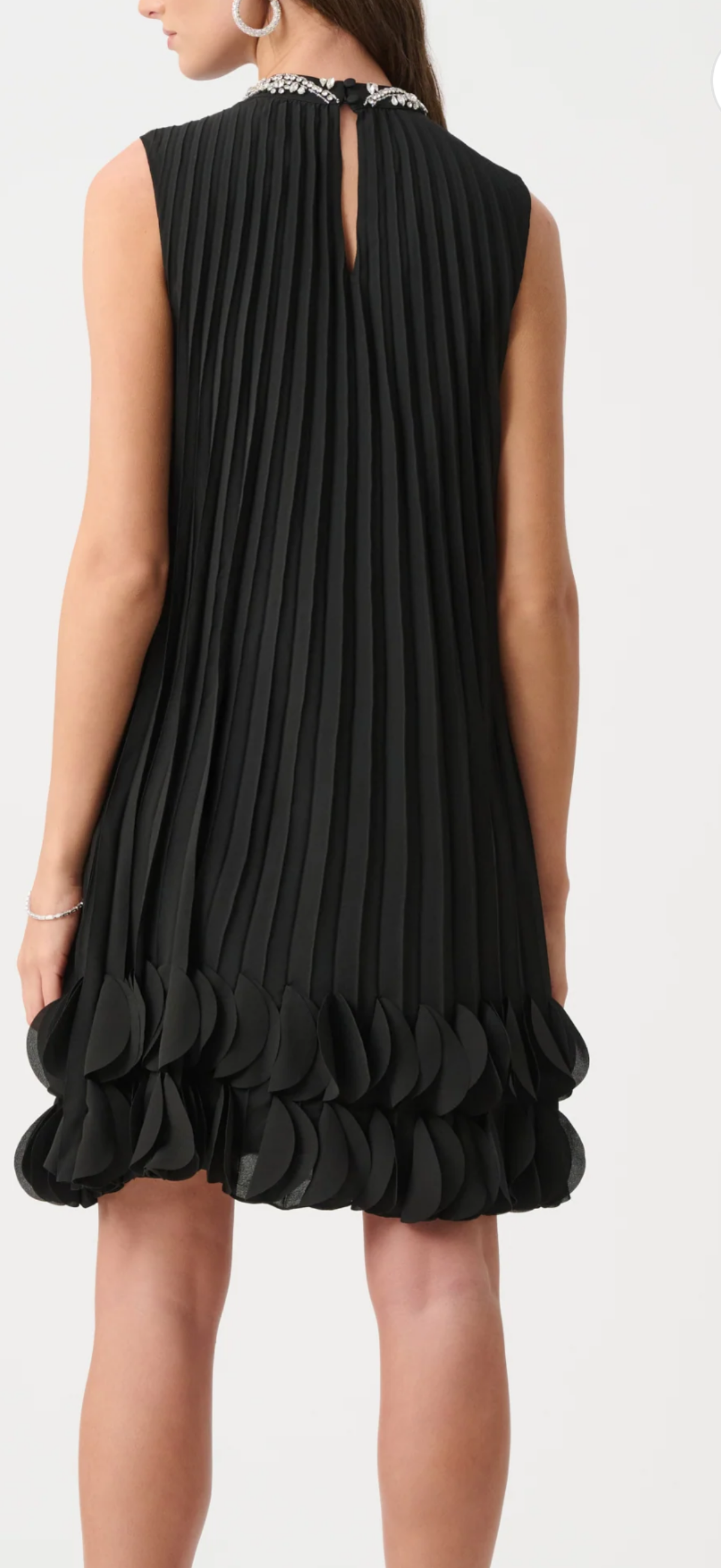 Joseph Ribkoff black pleated A line dress with rhinestone accent at neck, sleeveless, and 2 rows of ruffle at the hem