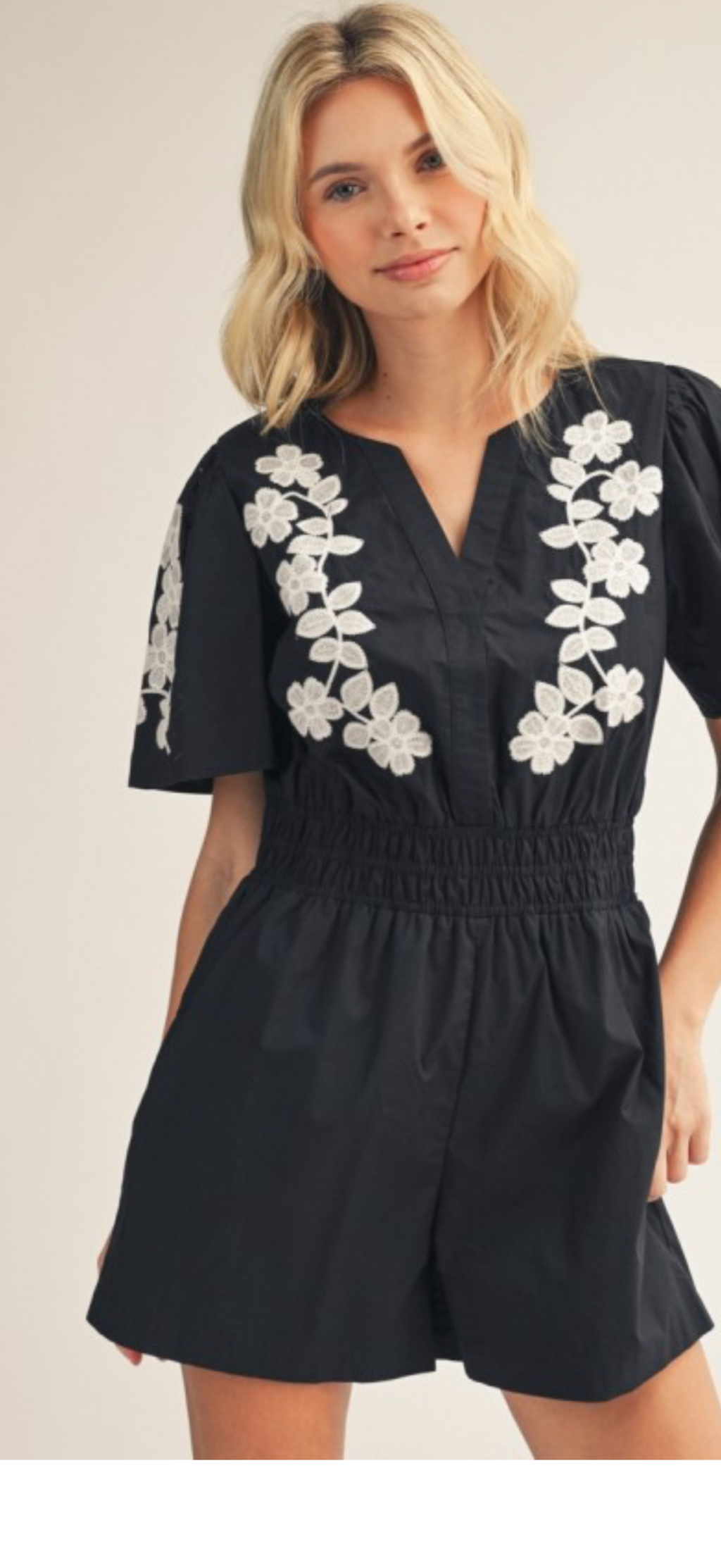 Jodifl  black elastic waist romper with white flower appliqué